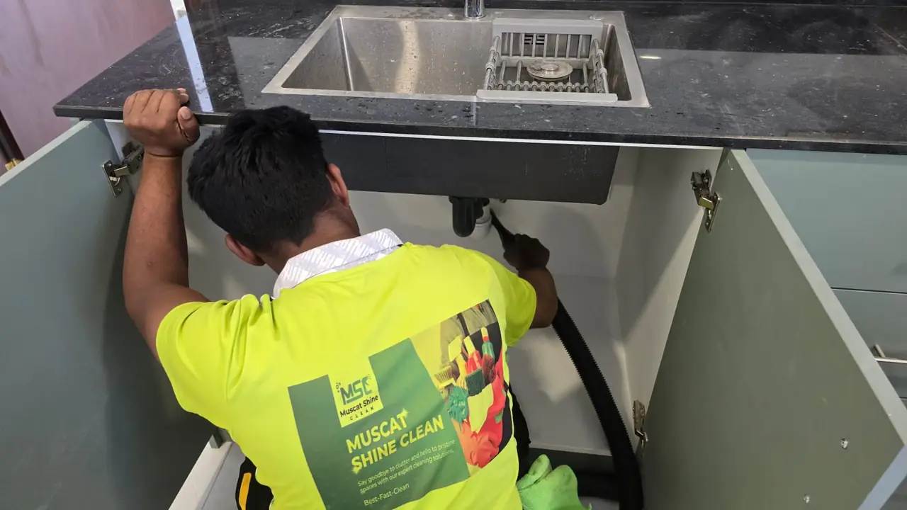 Professional deep cleaning in progress in a Muscat kitchen