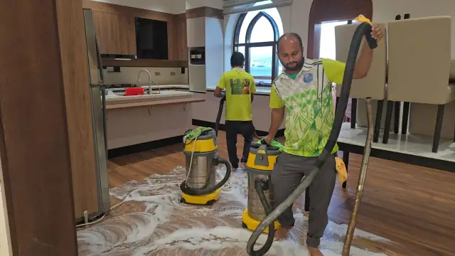 Muscat Shine Clear team deep cleaning villa floors with professional equipment